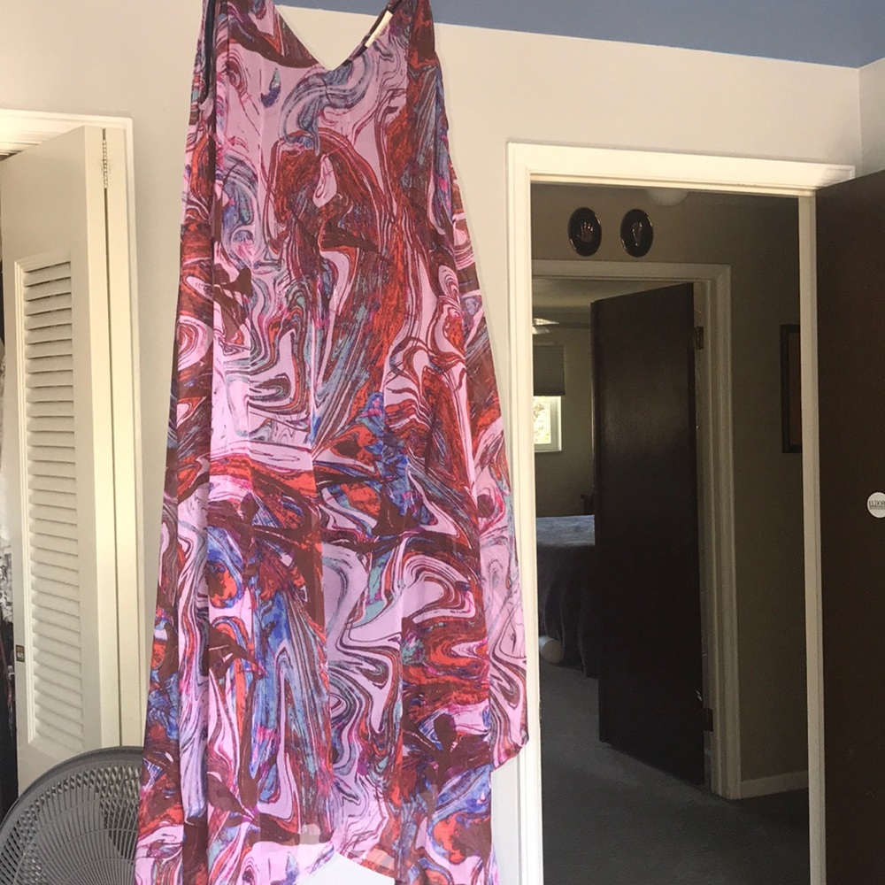 A medium length, flowy purple dress